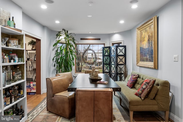 living area with wood finished floors and recessed lighting