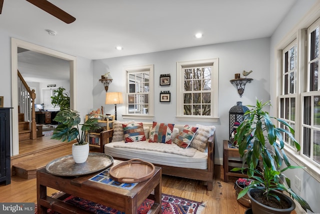 sitting room featuring recessed lighting, stairs, and light wood-style flooring
