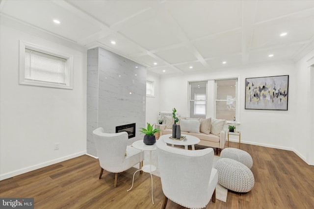 living area with recessed lighting, coffered ceiling, wood finished floors, and a fireplace