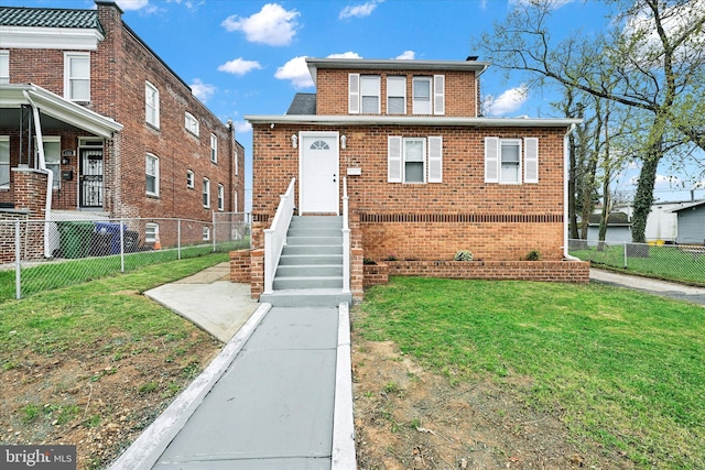 view of front of property featuring a front yard, brick siding, and fence