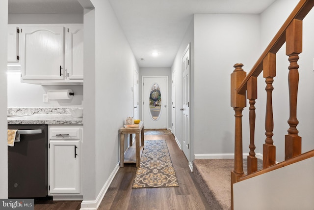 corridor featuring recessed lighting, stairs, dark wood-style flooring, and baseboards