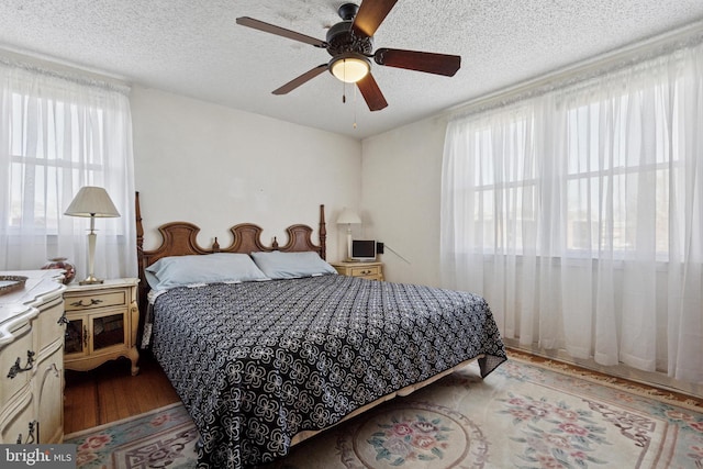 7121 Lawndale Ave, Philadelphia, PA 19111 - bedroom with ceiling fan, wood finished floors, and a textured ceiling