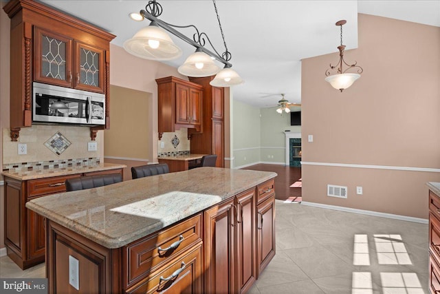5 Klockner Ct, Lawrence Township, NJ 08648 - kitchen with tasteful backsplash, visible vents, decorative light fixtures, ceiling fan, and stainless steel microwave