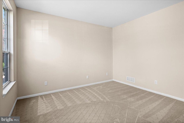 5 Klockner Ct, Lawrence Township, NJ 08648 - carpeted empty room with baseboards, visible vents, and plenty of natural light