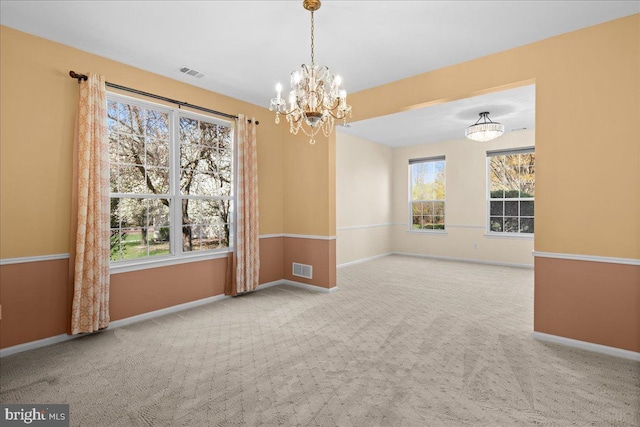 5 Klockner Ct, Lawrence Township, NJ 08648 - spare room featuring a chandelier, a healthy amount of sunlight, visible vents, and carpet floors