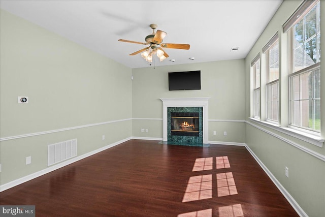 5 Klockner Ct, Lawrence Township, NJ 08648 - unfurnished living room featuring wood finished floors, visible vents, a ceiling fan, and a premium fireplace