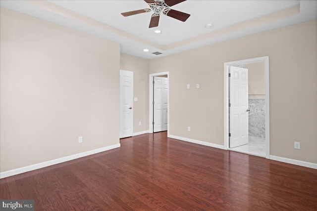 5 Klockner Ct, Lawrence Township, NJ 08648 - unfurnished bedroom with visible vents, baseboards, a raised ceiling, and wood finished floors