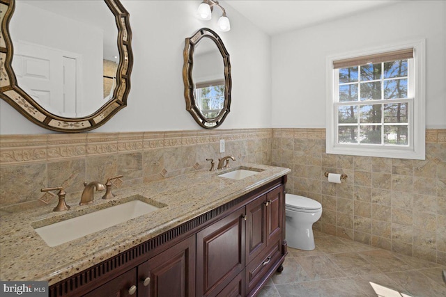 5 Klockner Ct, Lawrence Township, NJ 08648 - full bath featuring toilet, a sink, wainscoting, and tile walls