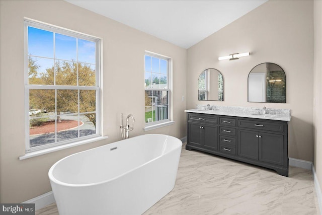 5 Klockner Ct, Lawrence Township, NJ 08648 - full bathroom featuring a freestanding bath, double vanity, baseboards, and a sink