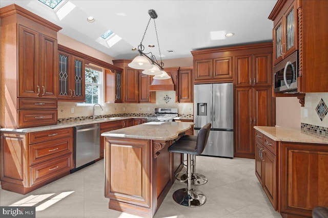 5 Klockner Ct, Lawrence Township, NJ 08648 - kitchen featuring a kitchen bar, a skylight, light stone counters, stainless steel appliances, and backsplash