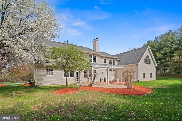 5 Klockner Ct, Lawrence Township, NJ 08648 - back of house featuring a chimney, a pergola, a patio area, and a lawn