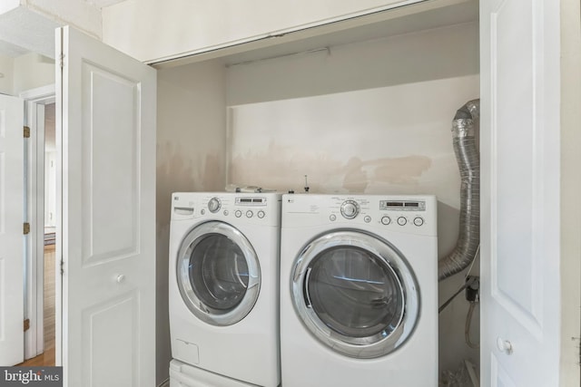 laundry area with separate washer and dryer and laundry area