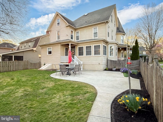 rear view of property featuring a patio
