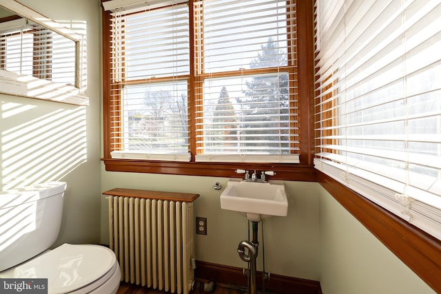 bathroom with radiator and toilet