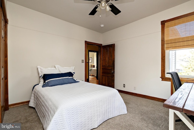 bedroom featuring carpet, baseboards, and ceiling fan