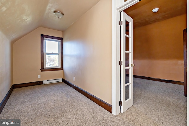 bonus room featuring baseboard heating, carpet, lofted ceiling, and baseboards