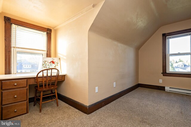 additional living space featuring vaulted ceiling, carpet flooring, plenty of natural light, and baseboards
