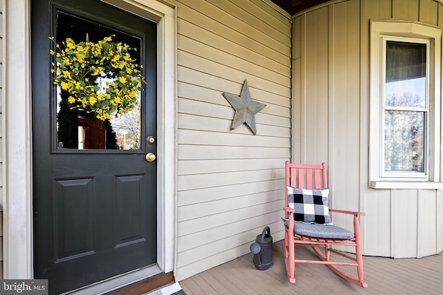 entrance to property featuring board and batten siding