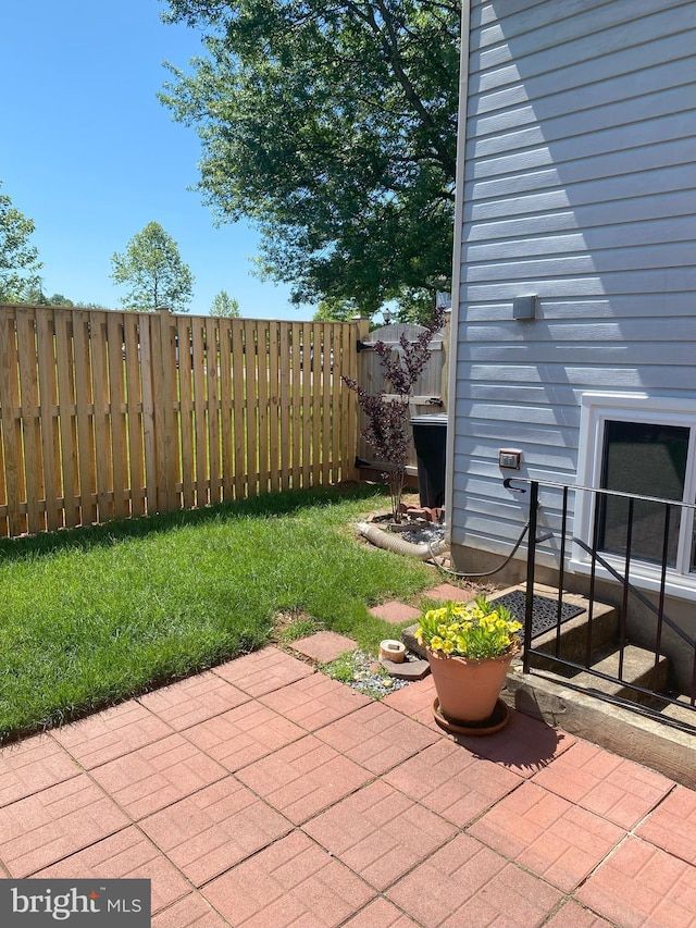 view of patio featuring fence