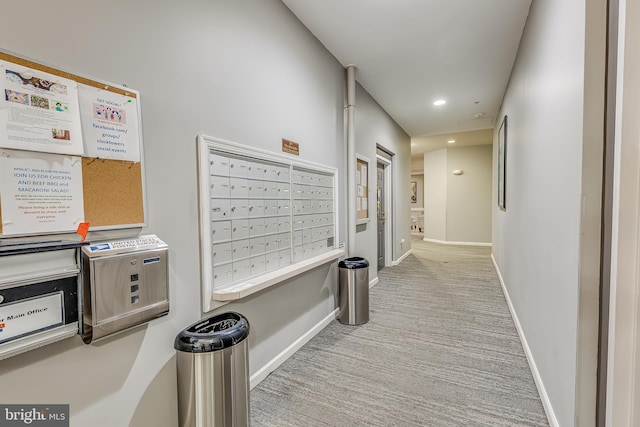 hallway with mail area, carpet flooring, baseboards, and recessed lighting