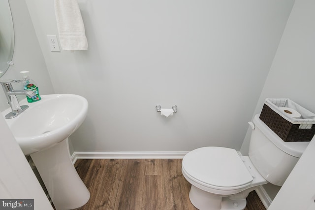 165 Correri St, Havre De Grace, MD 21078 - half bath with wood finished floors, toilet, and baseboards