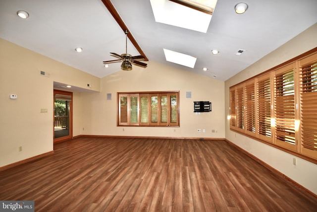 unfurnished living room featuring ceiling fan, baseboards, wood finished floors, visible vents, and lofted ceiling with skylight