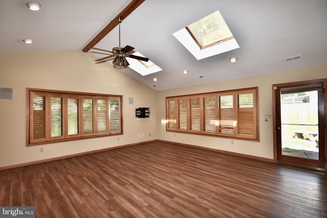 unfurnished living room featuring baseboards, wood finished floors, a skylight, and beamed ceiling