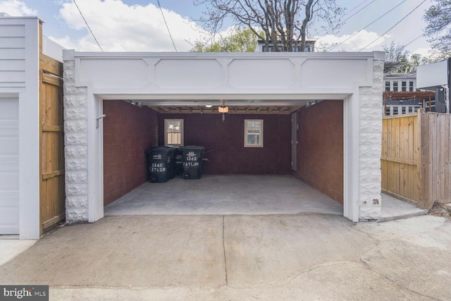 garage with fence