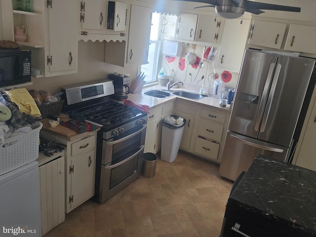 137 Washington Ave, Downingtown, PA 19335 - kitchen with a sink, ceiling fan, stainless steel appliances, light countertops, and white cabinetry