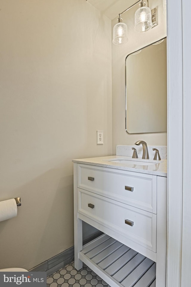 815 Kenneth Pl SE, Leesburg, VA 20175 - half bathroom with baseboards, vanity, and tile patterned flooring