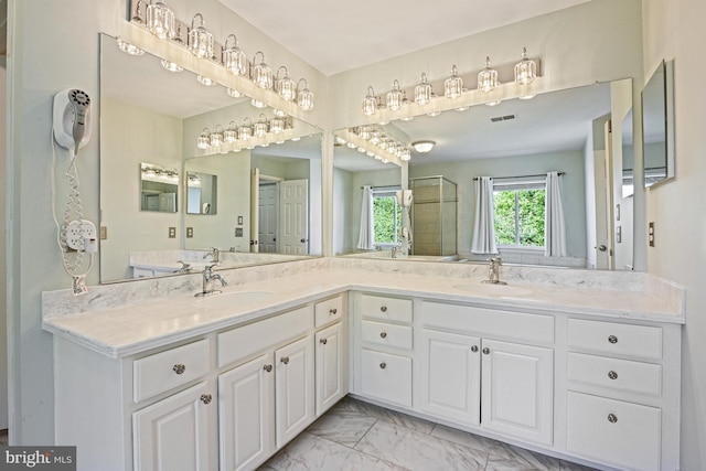 815 Kenneth Pl SE, Leesburg, VA 20175 - full bath featuring a sink, double vanity, a shower stall, and marble finish floor