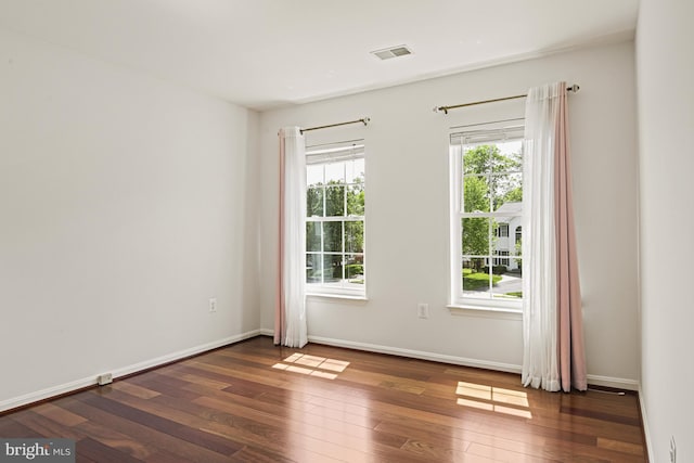 815 Kenneth Pl SE, Leesburg, VA 20175 - empty room featuring visible vents, baseboards, and hardwood / wood-style flooring