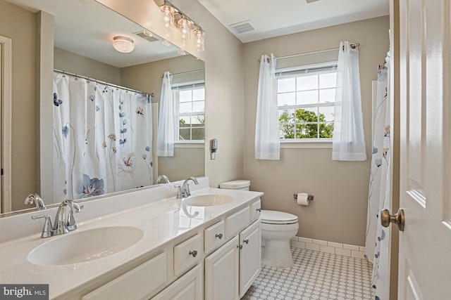 815 Kenneth Pl SE, Leesburg, VA 20175 - bathroom with toilet, visible vents, and a sink