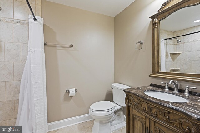 815 Kenneth Pl SE, Leesburg, VA 20175 - full bath featuring toilet, vanity, tile patterned floors, baseboards, and a tile shower