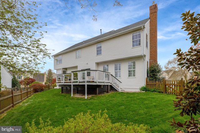 815 Kenneth Pl SE, Leesburg, VA 20175 - back of property featuring a fenced backyard, a deck, a chimney, and a lawn