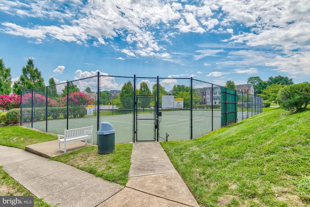 815 Kenneth Pl SE, Leesburg, VA 20175 - view of sport court with a gate, fence, and a lawn
