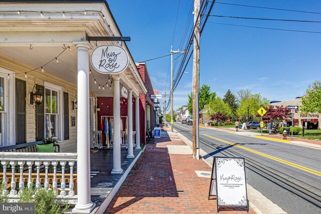 815 Kenneth Pl SE, Leesburg, VA 20175 - view of road featuring street lights, traffic signs, curbs, and sidewalks