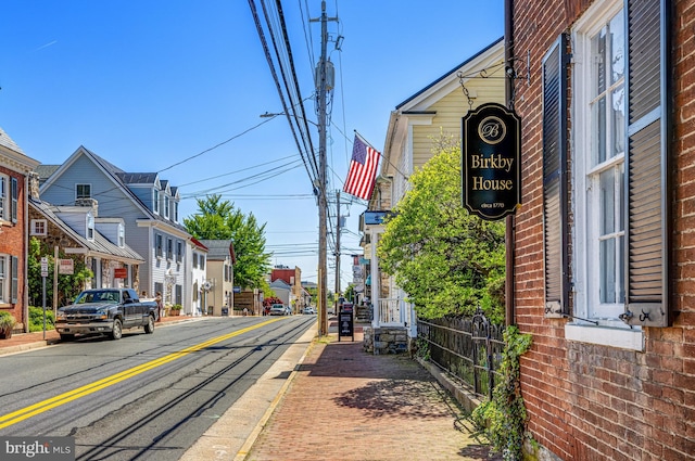 815 Kenneth Pl SE, Leesburg, VA 20175 - view of road with street lights, a residential view, curbs, and sidewalks