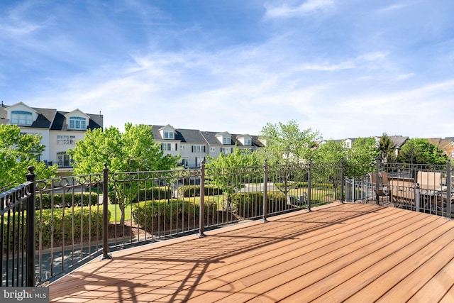 wooden terrace with a residential view