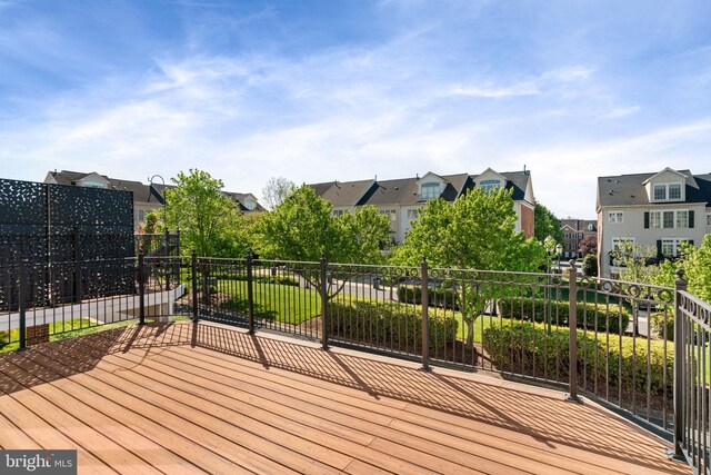 wooden deck featuring a residential view