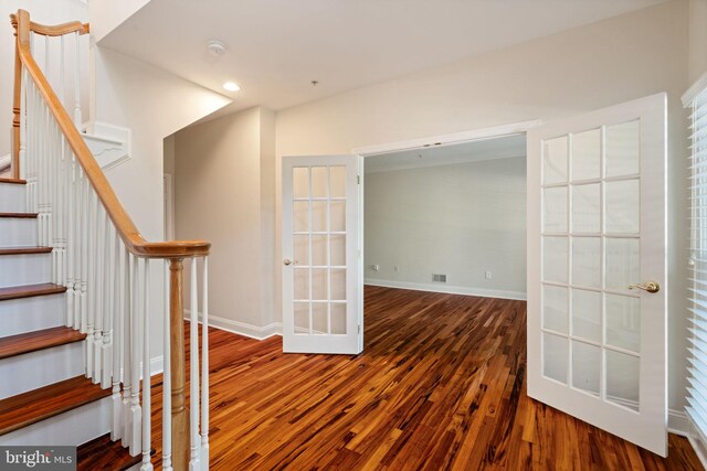 interior space with french doors, visible vents, wood finished floors, baseboards, and recessed lighting