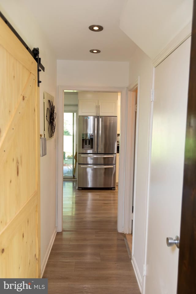 13909 Broomall Ln, Silver Spring, MD 20906 - hallway with recessed lighting, baseboards, a barn door, and wood finished floors