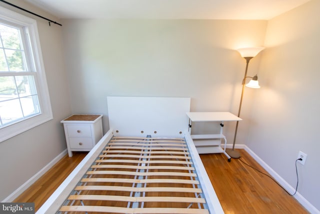 13909 Broomall Ln, Silver Spring, MD 20906 - bedroom with baseboards, multiple windows, and wood finished floors