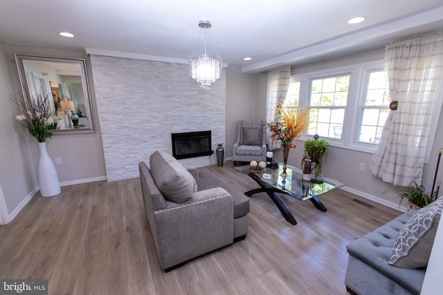 13909 Broomall Ln, Silver Spring, MD 20906 - living area with baseboards, a fireplace, wood finished floors, and visible vents