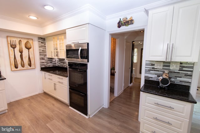 13909 Broomall Ln, Silver Spring, MD 20906 - kitchen with decorative backsplash, stainless steel microwave, ornamental molding, and dobule oven black