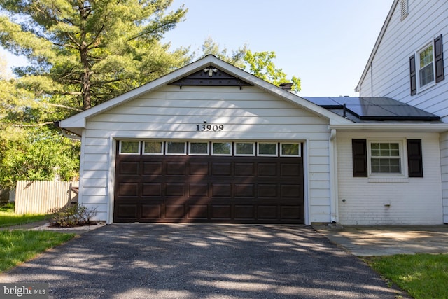13909 Broomall Ln, Silver Spring, MD 20906 - garage with fence and roof mounted solar panels