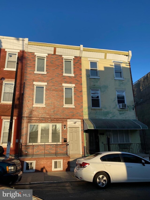 townhome / multi-family property featuring brick siding
