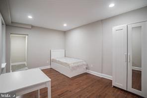 unfurnished bedroom with recessed lighting, baseboards, and wood finished floors