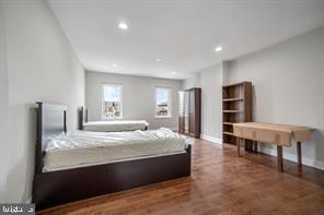 bedroom with baseboards, recessed lighting, and wood finished floors