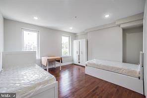 bedroom featuring dark wood-type flooring and recessed lighting